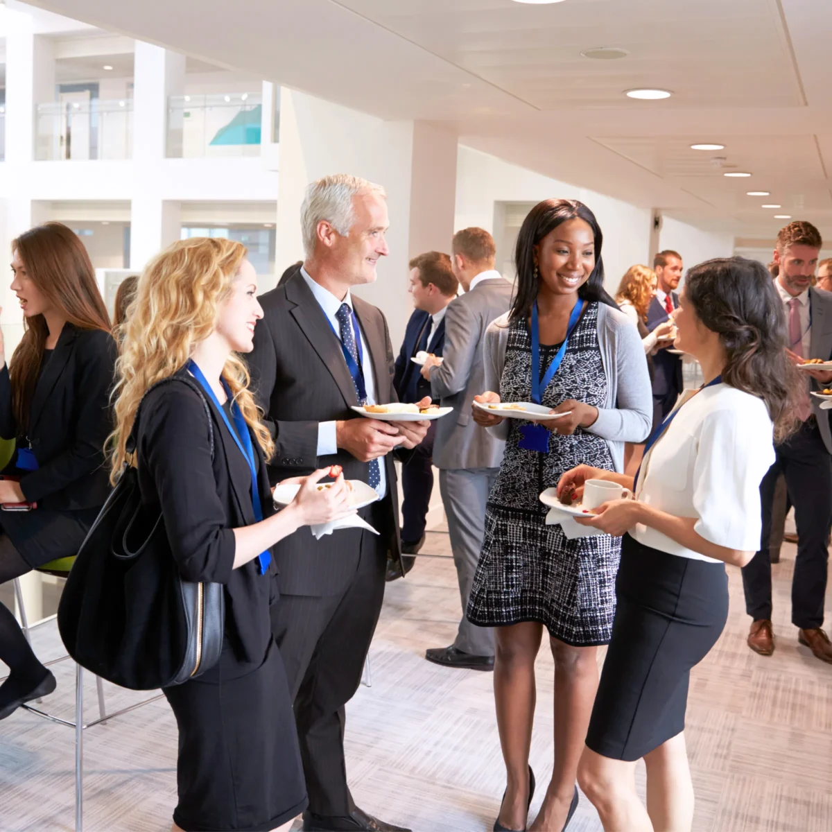 Small business hosting an in-person networking event to create real-world customer experiences