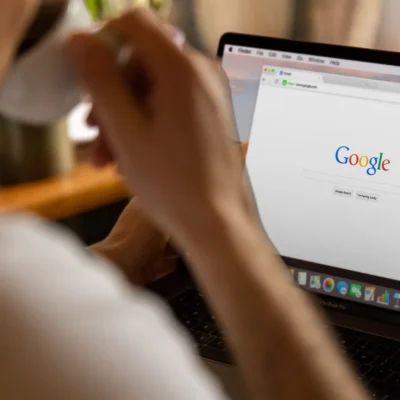 Person searching on Google to find local franchise services online
